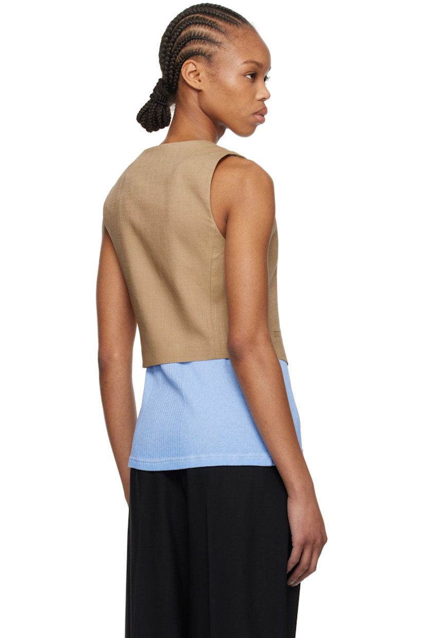 Plain-woven stretch viscose-blend vest. 

· Y-neck
· Button closure
· Mock welt pockets
· Full crêpe lining

Supplier color: Beige