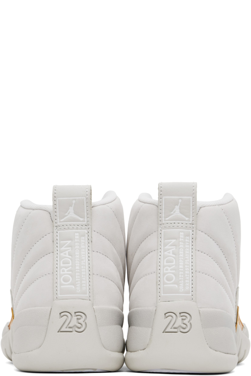 High-top quilted nubuck sneakers in beige.

· Lace-up closure
· Logo embroidered at padded tongue
· Padded collar
· Logo embossed at outer side 
· Logo-printed pull-loop at heel tab
· Jersey lining
· Concealed Nike Air unit at midsole
· Treaded rubber sole

Please note that this item may be shipped only within North America.

Supplier color: Phantom/Metallic gold/White
