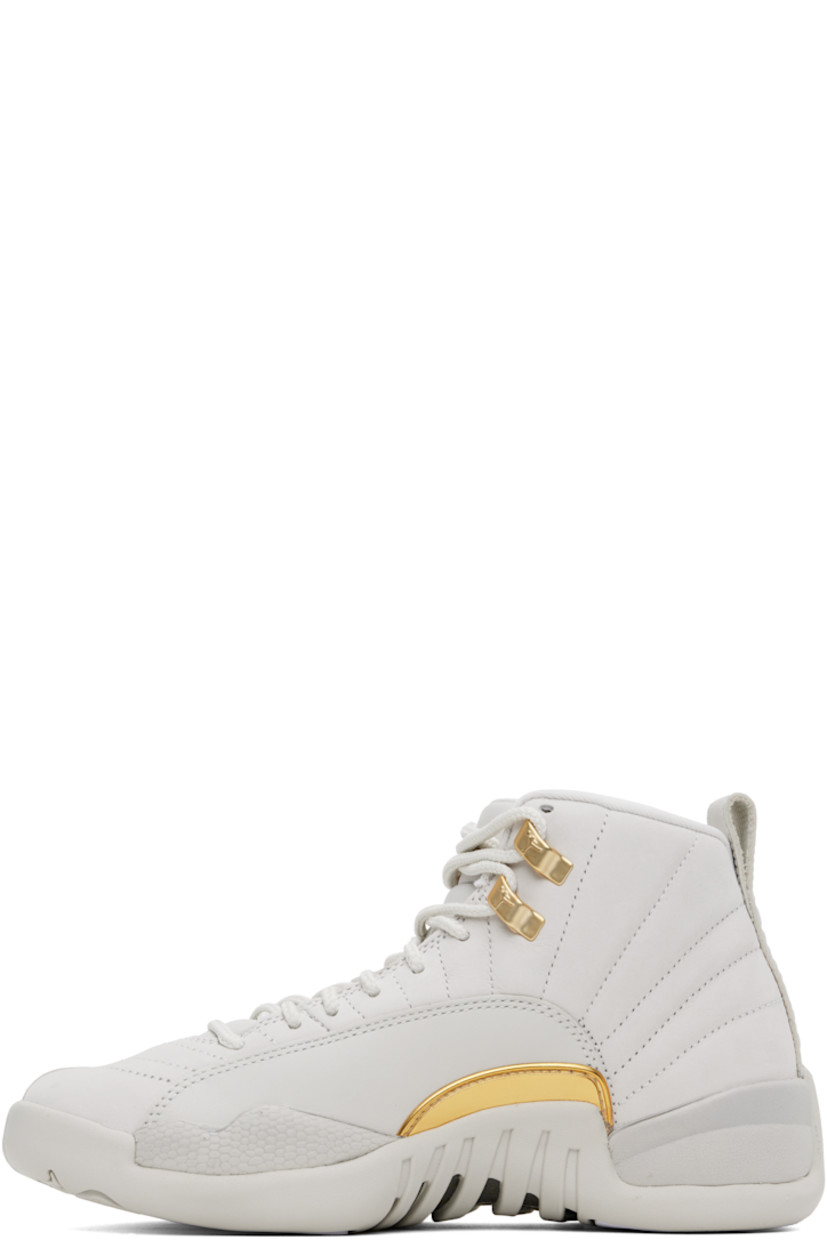 High-top quilted nubuck sneakers in beige.

· Lace-up closure
· Logo embroidered at padded tongue
· Padded collar
· Logo embossed at outer side 
· Logo-printed pull-loop at heel tab
· Jersey lining
· Concealed Nike Air unit at midsole
· Treaded rubber sole

Please note that this item may be shipped only within North America.

Supplier color: Phantom/Metallic gold/White