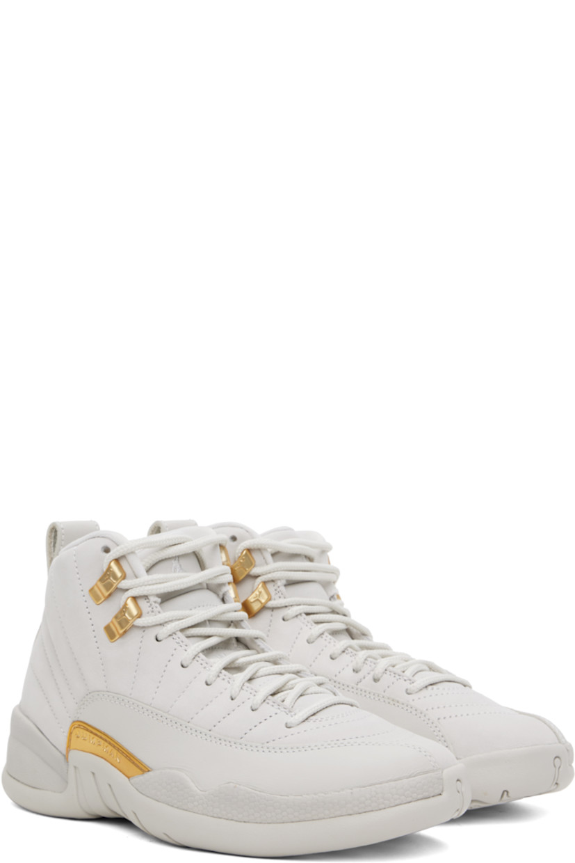 High-top quilted nubuck sneakers in beige.

· Lace-up closure
· Logo embroidered at padded tongue
· Padded collar
· Logo embossed at outer side 
· Logo-printed pull-loop at heel tab
· Jersey lining
· Concealed Nike Air unit at midsole
· Treaded rubber sole

Please note that this item may be shipped only within North America.

Supplier color: Phantom/Metallic gold/White