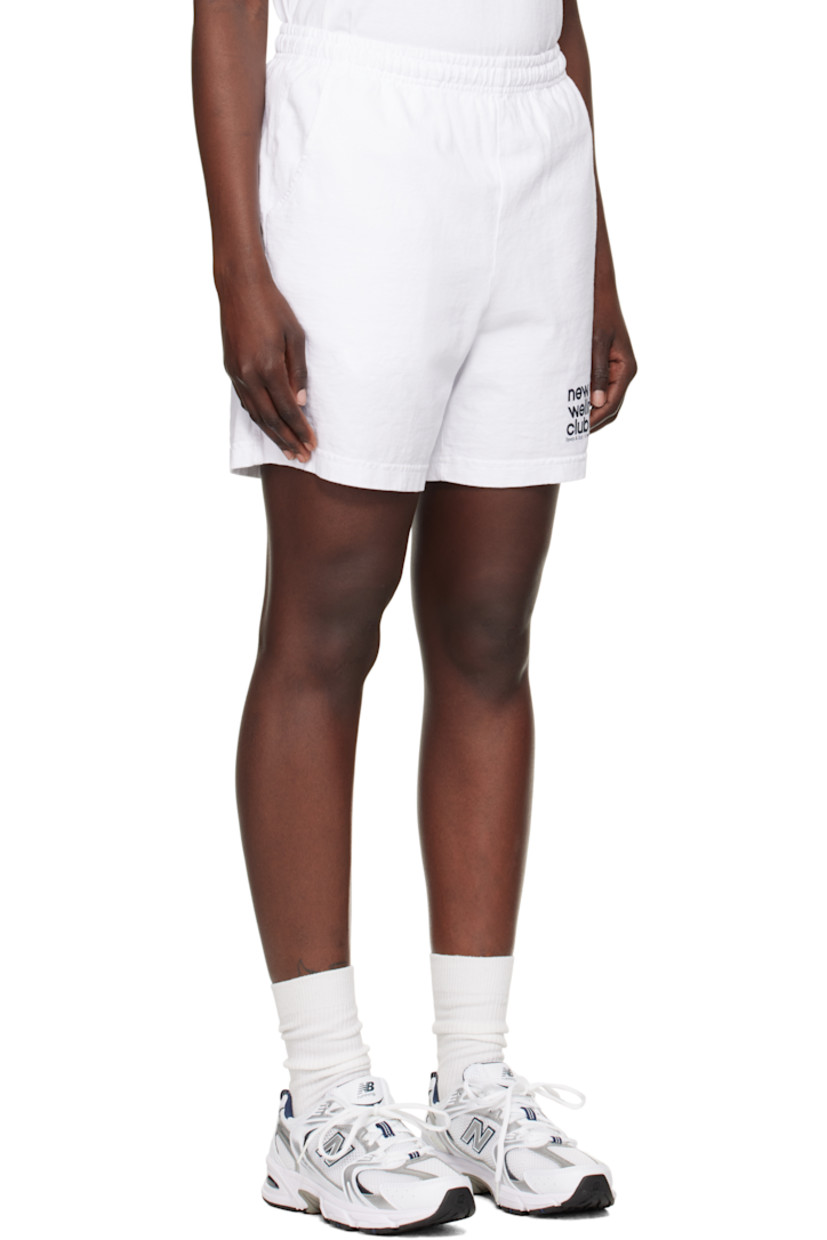 Garment-dyed 9 oz cotton jersey shorts.

· Pre-shrunk
· Concealed drawstring at elasticized waistband
· Three-pocket styling
· Logo graphic printed at front hem

Supplier color: White/Navy