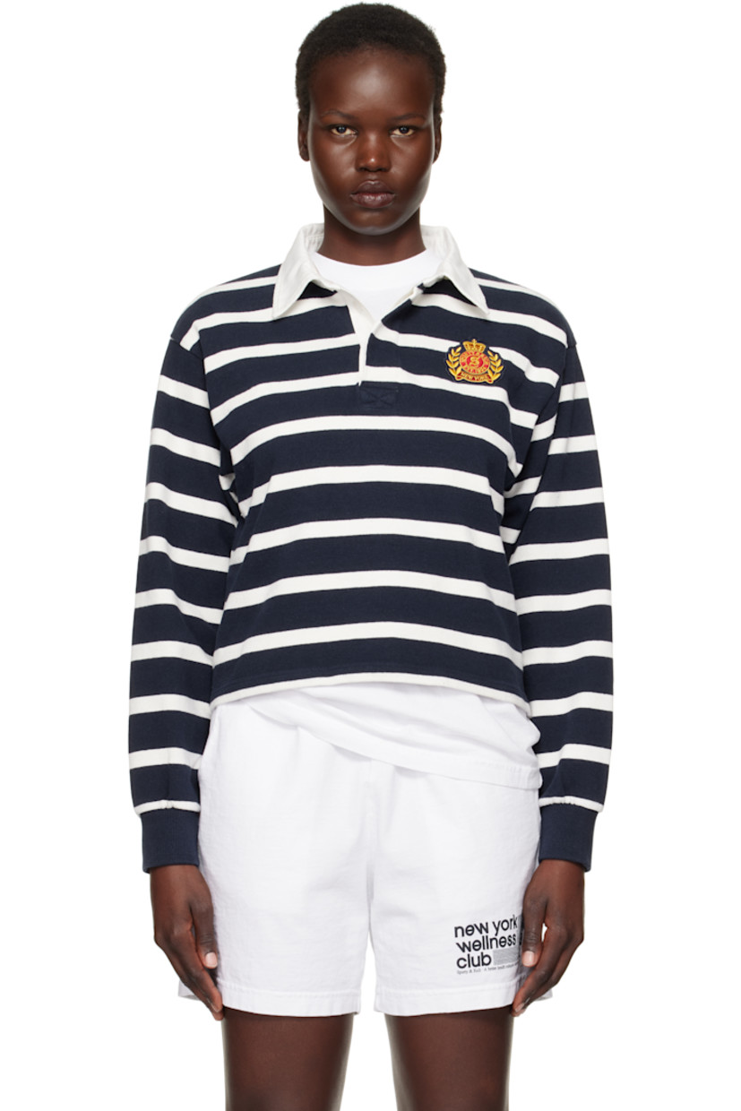 Pre-shrunk knit cotton polo. Stripes throughout. 

· Twill spread collar
· Concealed three-button placket
· Embroidered logo patch at chest 
· Rib-knit cuffs
· Mother-of-pearl hardware

Supplier color: White/Navy