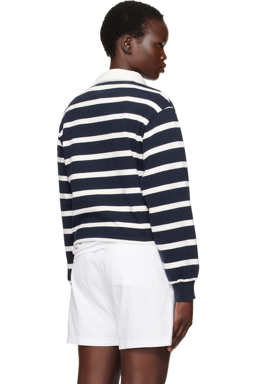 Pre-shrunk knit cotton polo. Stripes throughout. 

· Twill spread collar
· Concealed three-button placket
· Embroidered logo patch at chest 
· Rib-knit cuffs
· Mother-of-pearl hardware

Supplier color: White/Navy