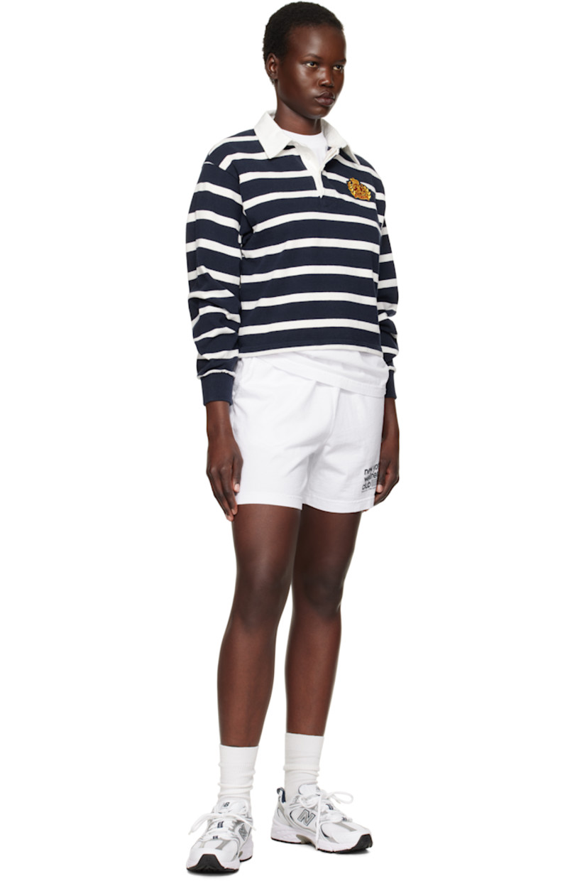 Pre-shrunk knit cotton polo. Stripes throughout. 

· Twill spread collar
· Concealed three-button placket
· Embroidered logo patch at chest 
· Rib-knit cuffs
· Mother-of-pearl hardware

Supplier color: White/Navy