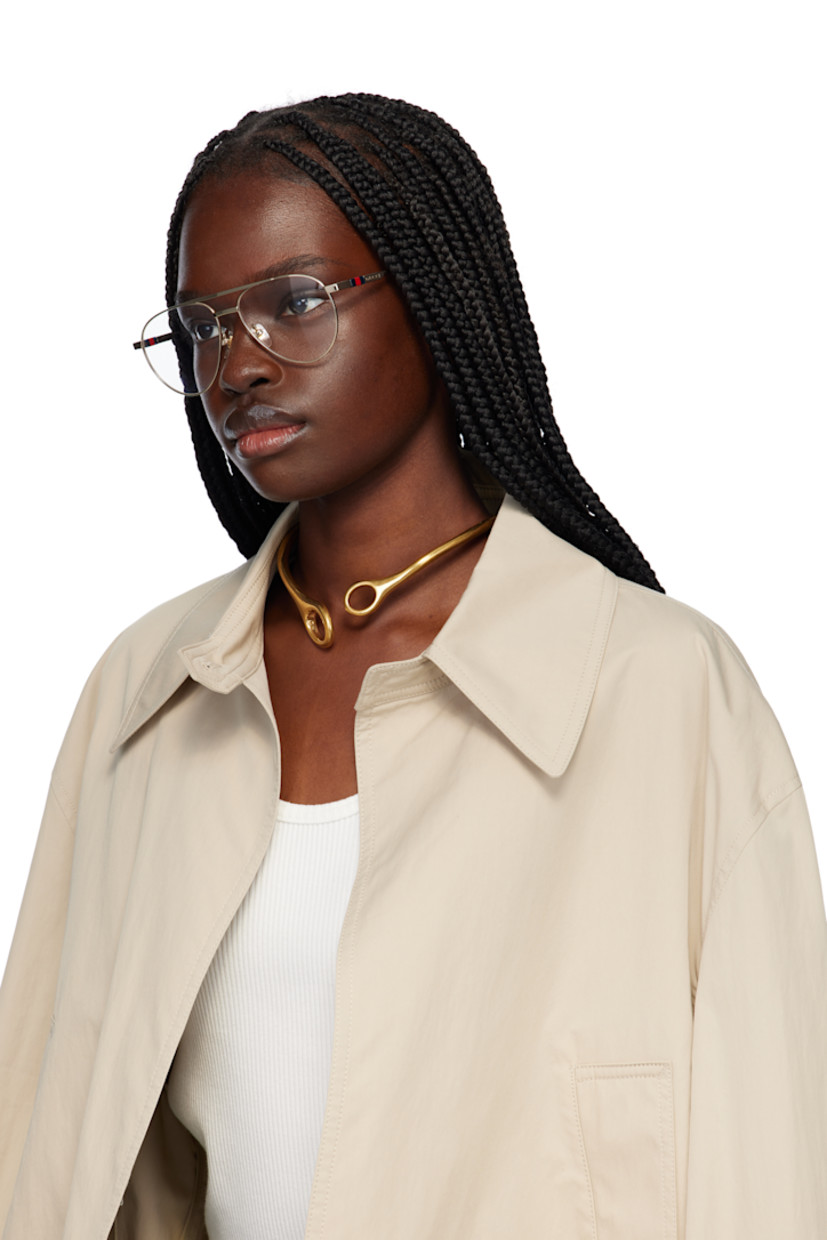 Aviator-style metal-frame optical glasses in gold tone. 

· Top bar
· Adjustable rubber nose pads
· Logo hardware and engraved logo at temple
· Tortoiseshell acetate temple tips
· Includes case
· Size: 56.15 145

Supplier color: Gold