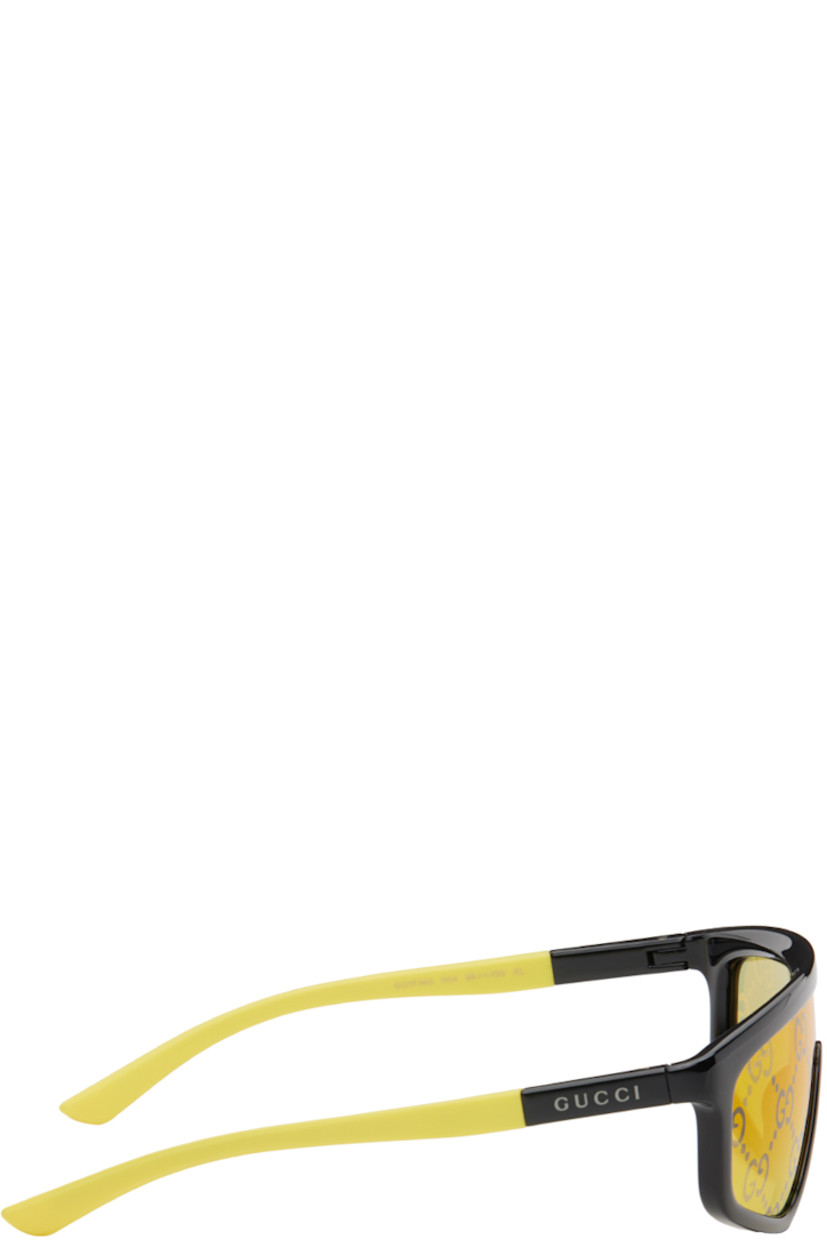 Shield-style acetate- and polymer-frame sunglasses in black and yellow.

· Logo pattern at mirrored yellow lens
· 100% UV protection, Category 1
· Integrated nose pads
· Logo printed at temples
· Includes velvet case
· Size: 99.1 135

Supplier color: Black/Yellow/Yellow