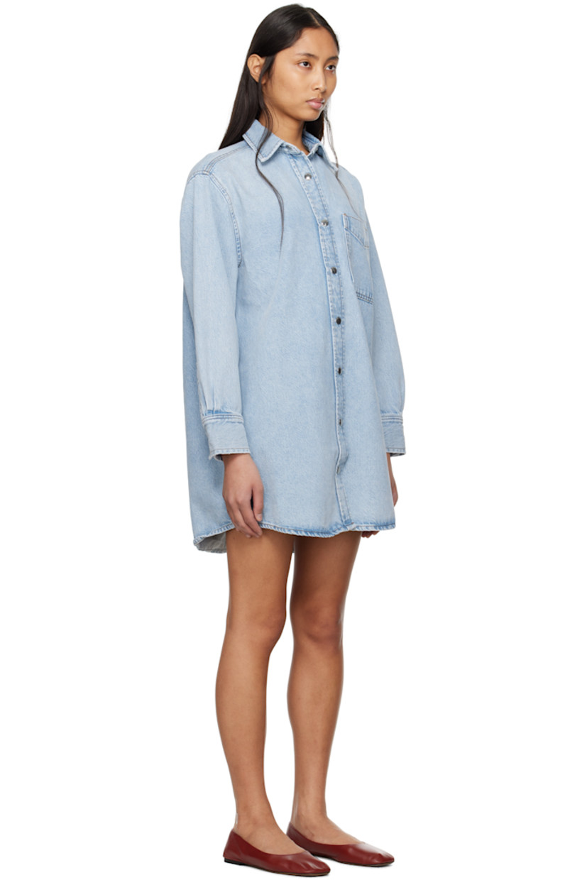 Non-stretch organic cotton- and recycled lyocell-blend denim minidress. Fading and subtle distressing throughout. 

· Spread collar
· Press-stud closure
· Patch pocket at chest
· Shirttail hem
· Pleats at press-stud barrel cuffs
· Contrast stitching in tan

Supplier color: Etti