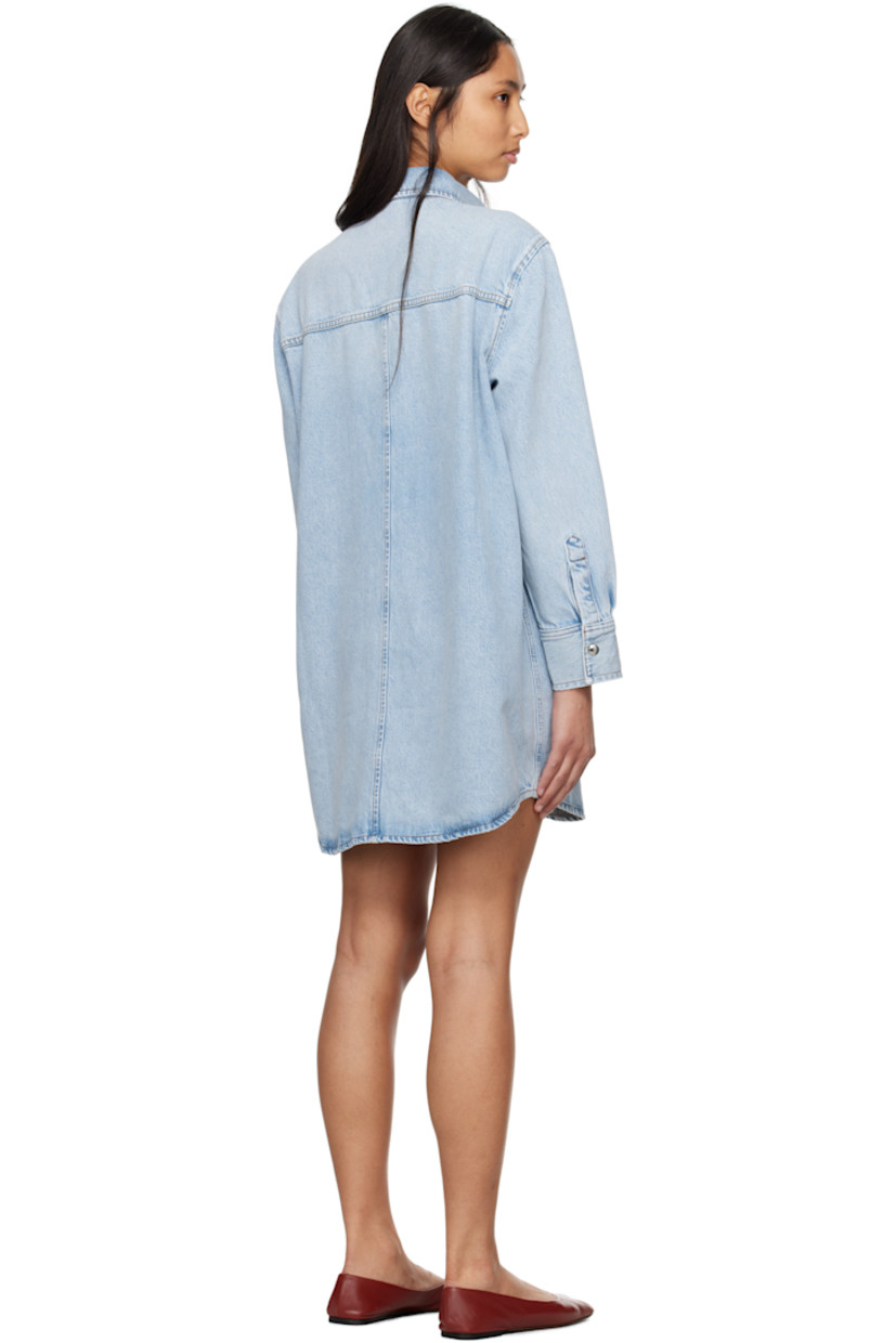 Non-stretch organic cotton- and recycled lyocell-blend denim minidress. Fading and subtle distressing throughout. 

· Spread collar
· Press-stud closure
· Patch pocket at chest
· Shirttail hem
· Pleats at press-stud barrel cuffs
· Contrast stitching in tan

Supplier color: Etti