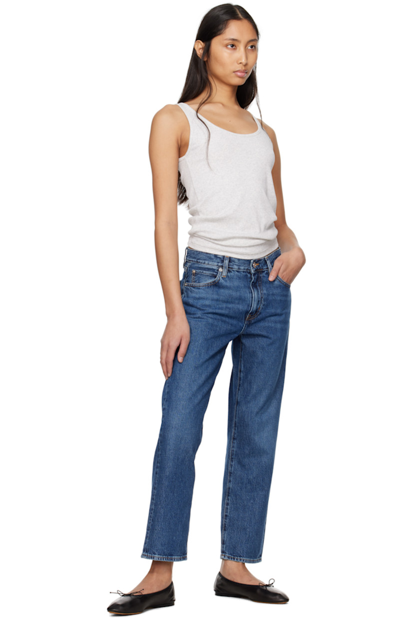 Loose-fit and straight-leg non-stretch regenerative cotton denim jeans. Fading and whiskering throughout. 

· Mid-rise
· Belt loops
· Five-pocket styling
· Zip fly
· Contrast stitching in tan

Supplier color: Dark indigo