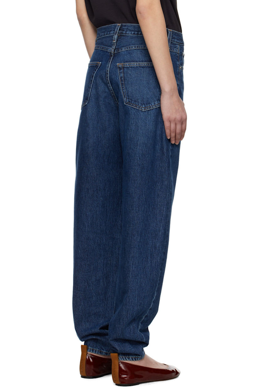 Non-stretch regenerative cotton denim jeans. Fading, whiskering, and subtle distressing throughout.

· Loose-fit and tapered
· High-rise
· Belt loops
· Five-pocket styling
· Zip fly
· Logo-engraved silver-tone hardware
· Contrast stitching in tan

Supplier color: Kirk