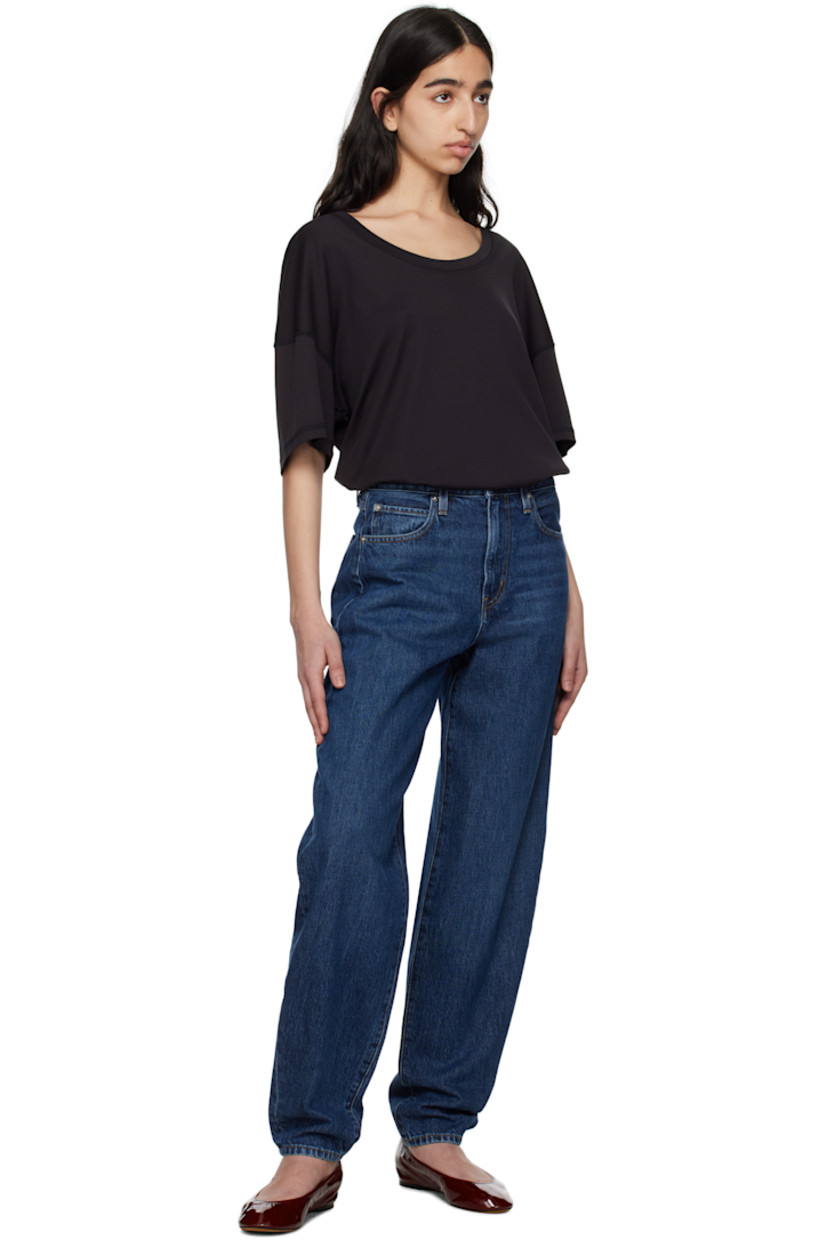 Non-stretch regenerative cotton denim jeans. Fading, whiskering, and subtle distressing throughout.

· Loose-fit and tapered
· High-rise
· Belt loops
· Five-pocket styling
· Zip fly
· Logo-engraved silver-tone hardware
· Contrast stitching in tan

Supplier color: Kirk