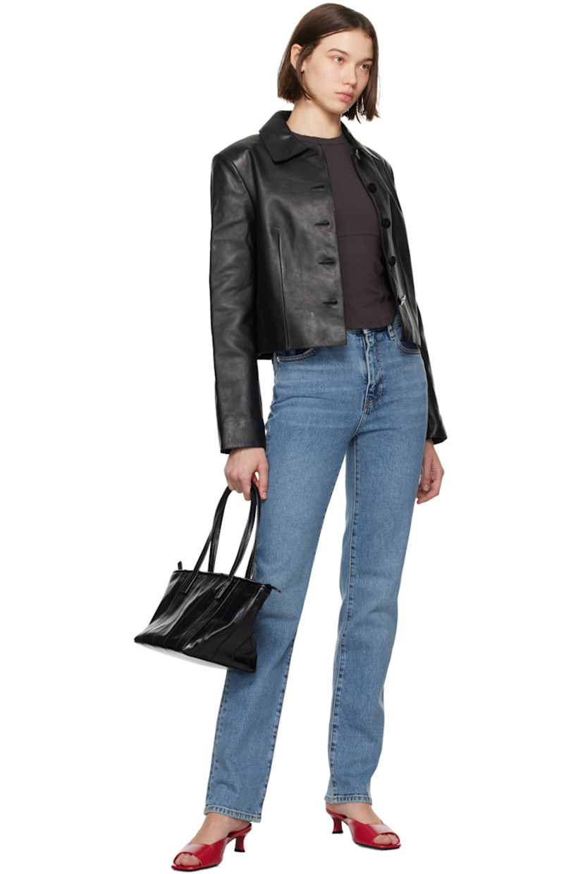 Slim-fit straight-leg stretch denim jeans. Fading and whiskering throughout. 

· High-rise 
· Belt loops
· Five-pocket styling
· Zip-fly
· Logo-engraved silver-tone hardware
· Contrast stitching in tan 

Supplier color: Indio