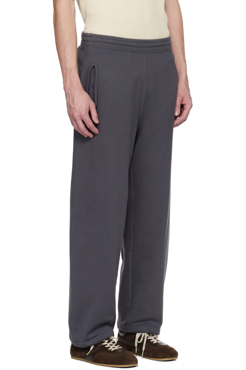 Reversible French terry sweatpants. Overlock stitching throughout. 

Reverse in gray French terry. 

· Drawstring at elasticized waistband
· Three-pocket styling
· Bungee-style drawstring at cuffs

Part of the ONE OCEAN, ALL LANDS capsule.

Supplier color: Charcoal gray