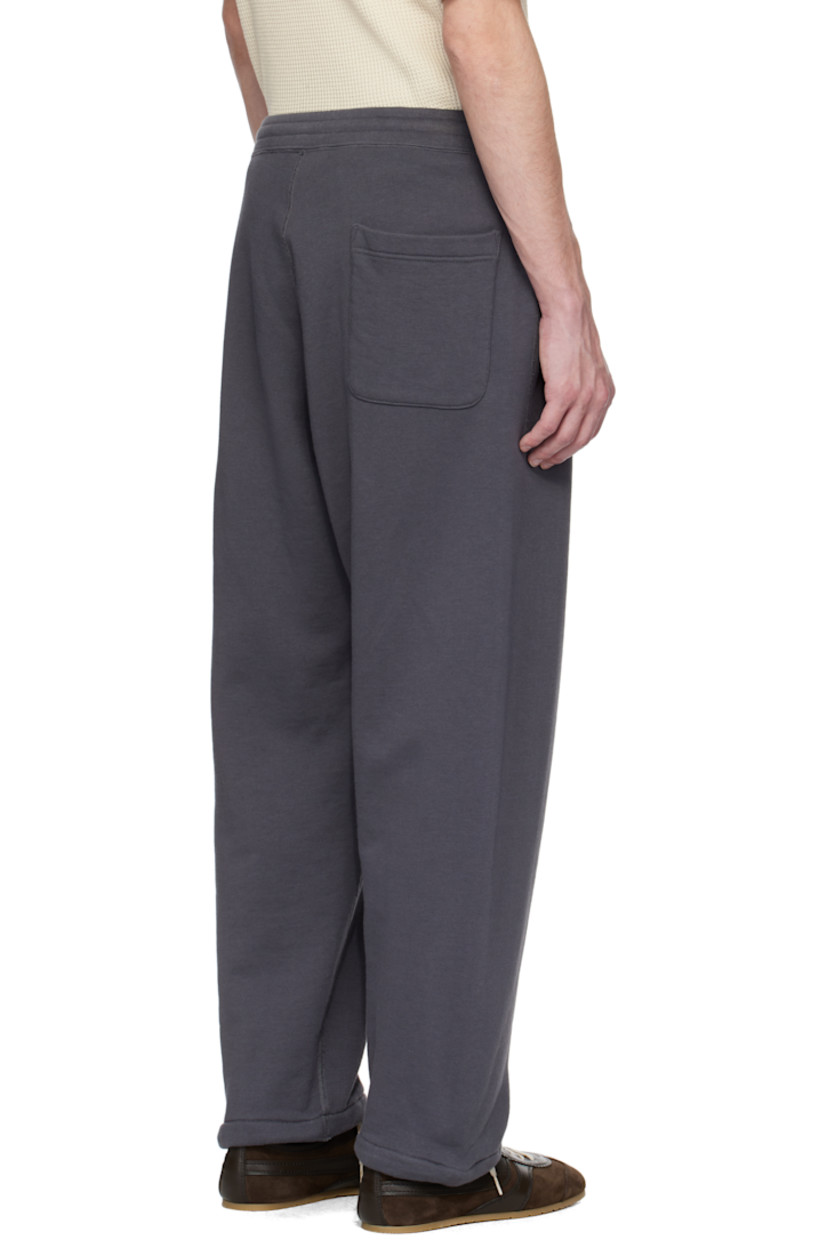 Reversible French terry sweatpants. Overlock stitching throughout. 

Reverse in gray French terry. 

· Drawstring at elasticized waistband
· Three-pocket styling
· Bungee-style drawstring at cuffs

Part of the ONE OCEAN, ALL LANDS capsule.

Supplier color: Charcoal gray