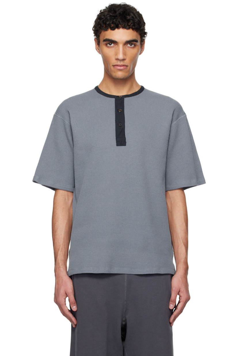 Waffle-knit cotton- and polyester-blend henley. 

· Crewneck
· Three-button placket

Part of the ONE OCEAN, ALL LANDS capsule.

Supplier color: Blue gray