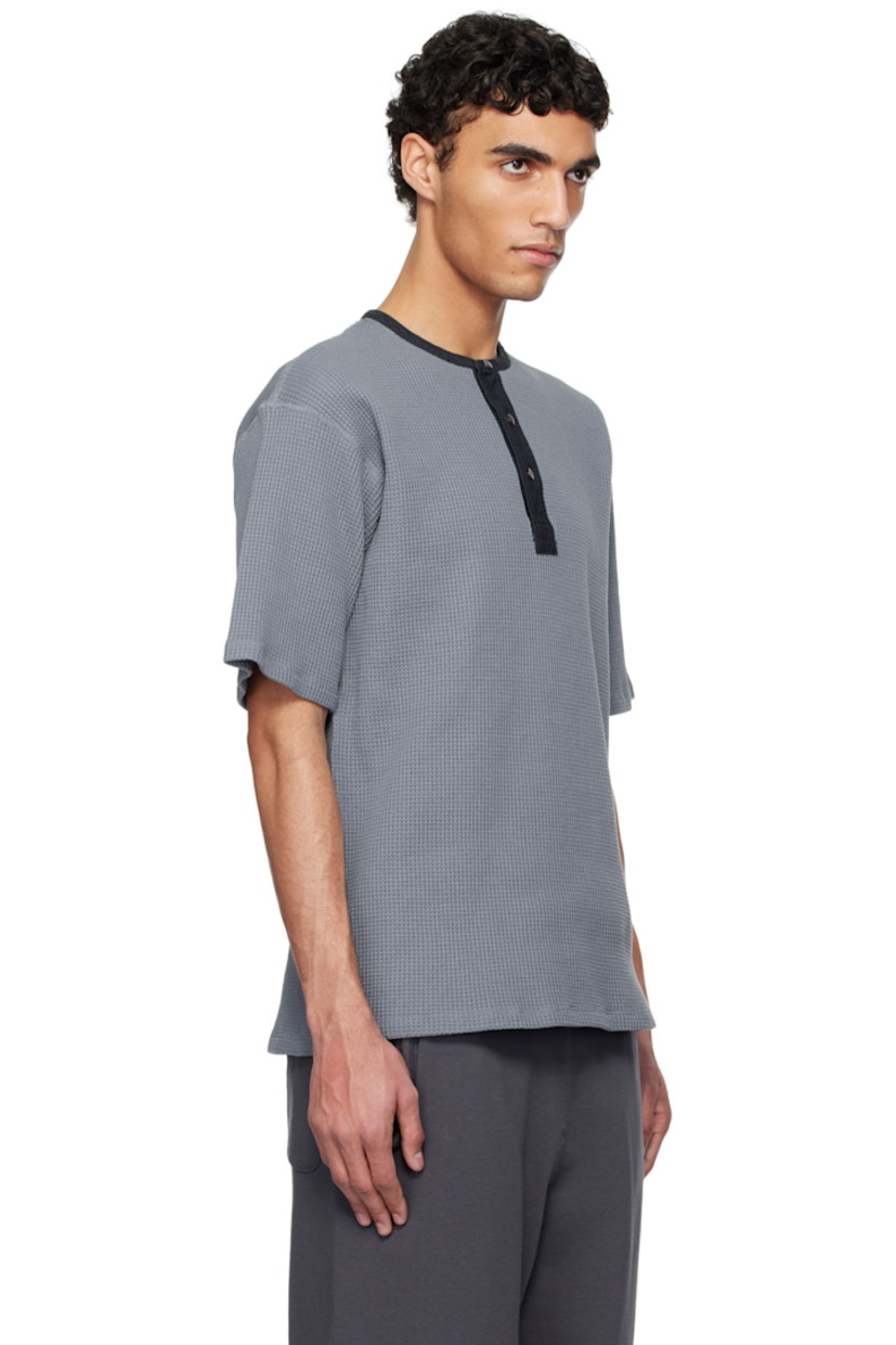 Waffle-knit cotton- and polyester-blend henley. 

· Crewneck
· Three-button placket

Part of the ONE OCEAN, ALL LANDS capsule.

Supplier color: Blue gray
