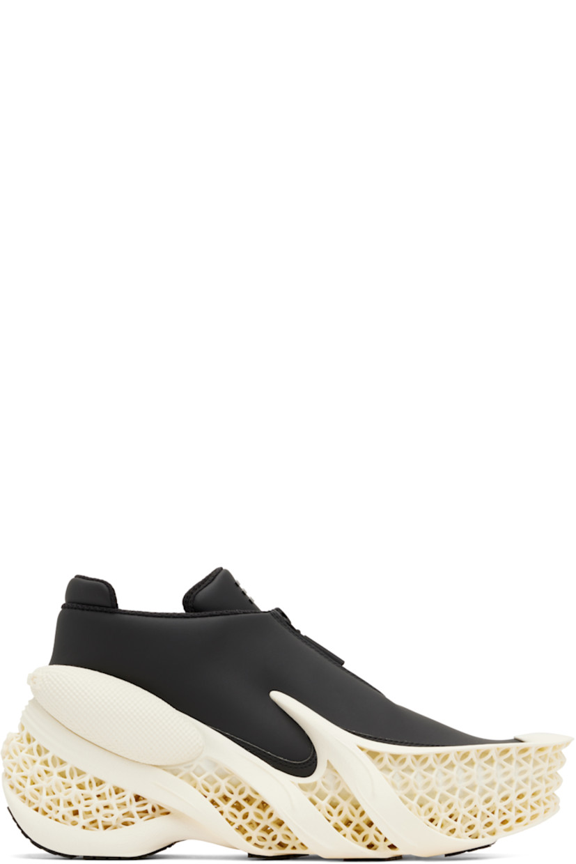 Low-top faux-leather sneakers in black.

· Extended rubber cap toe
· Zip closure at vamp
· Logo bonded at padded tongue
· Padded collar
· Pull-tab at heel collar
· Logo embossed at heel counter
· Mesh lining
· Sculptural 3D-printed rubber platform midsole
· Treaded recycled rubber sole
· Platform: H2.5"

Supplier color: Euphoric black