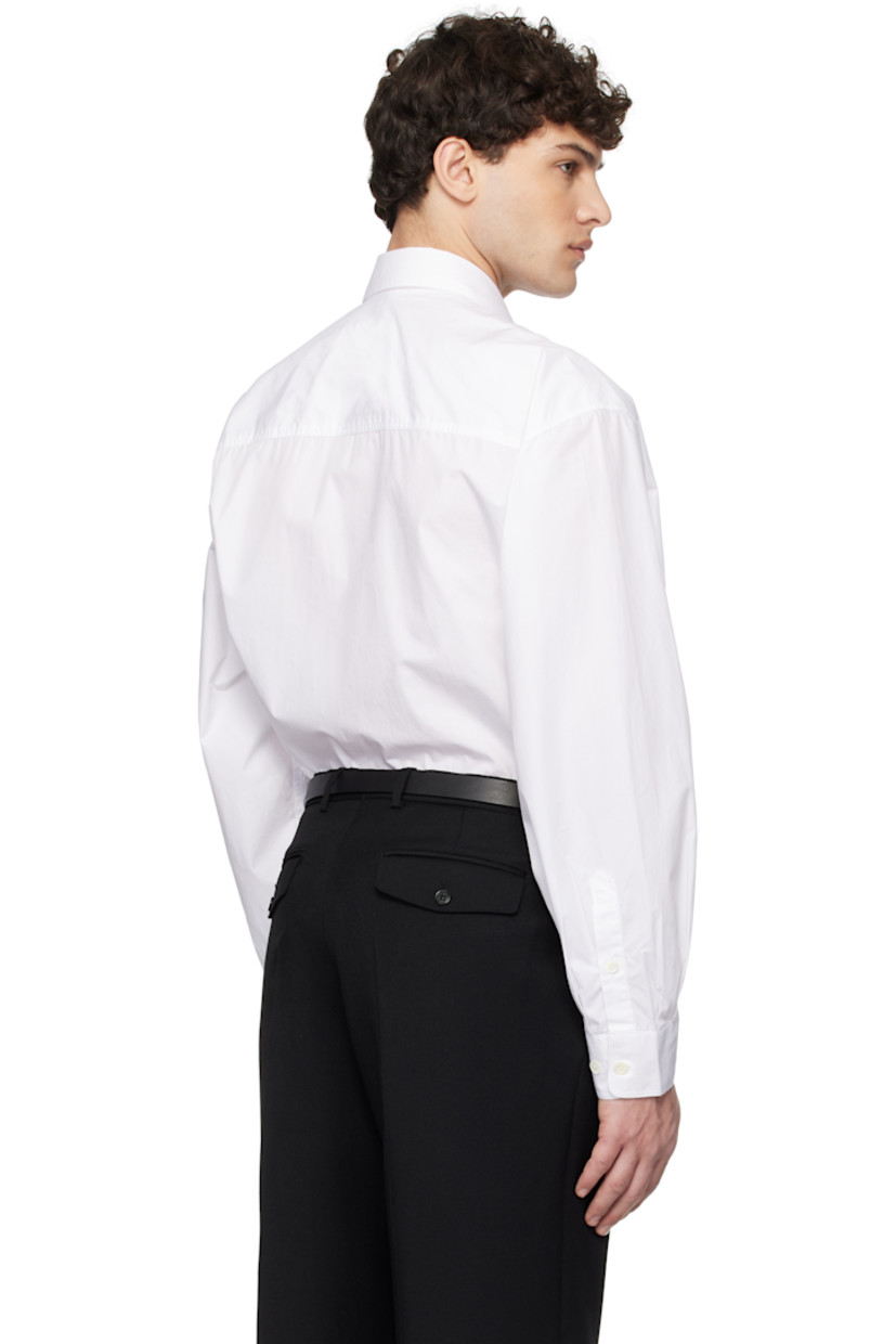120's cotton poplin shirt. 

· Spread collar
· Button closure
· Flap pockets
· Shirttail hem
· Pleats at adjustable single-button barrel cuffs
· Mother-of-pearl hardware

Supplier color: White