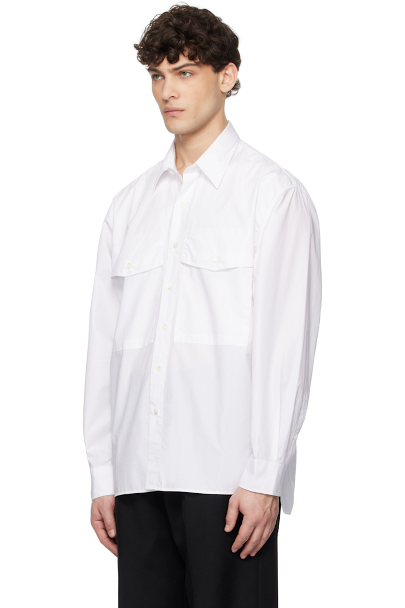 120's cotton poplin shirt. 

· Spread collar
· Button closure
· Flap pockets
· Shirttail hem
· Pleats at adjustable single-button barrel cuffs
· Mother-of-pearl hardware

Supplier color: White