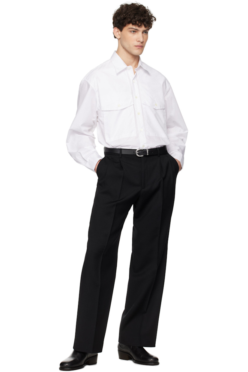 120's cotton poplin shirt. 

· Spread collar
· Button closure
· Flap pockets
· Shirttail hem
· Pleats at adjustable single-button barrel cuffs
· Mother-of-pearl hardware

Supplier color: White