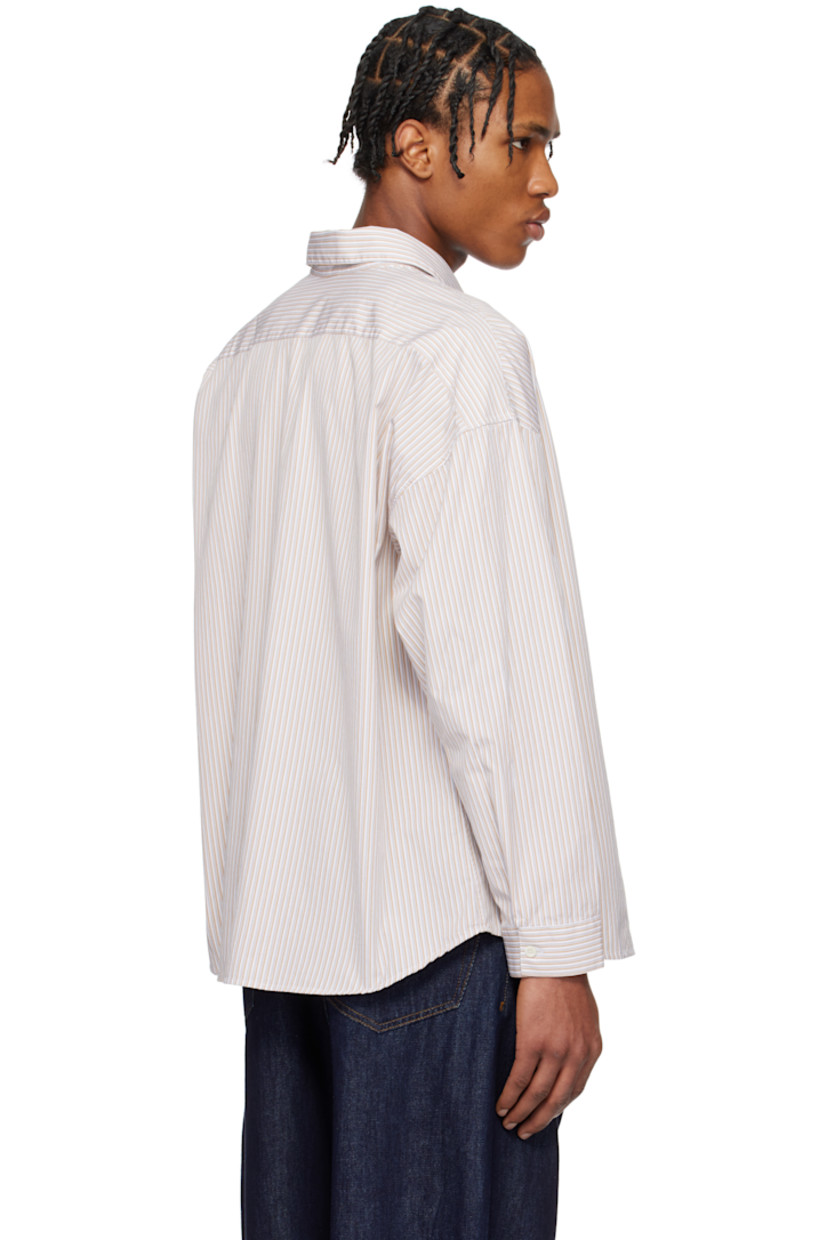 Lightweight cotton poplin shirt. Stripes throughout.

· Spread collar
· Button closure
· Patch pocket at chest
· Shirttail hem
· Dropped shoulders
· Single-button barrel cuffs
· Mother-of-pearl hardware

Supplier color: Sand
