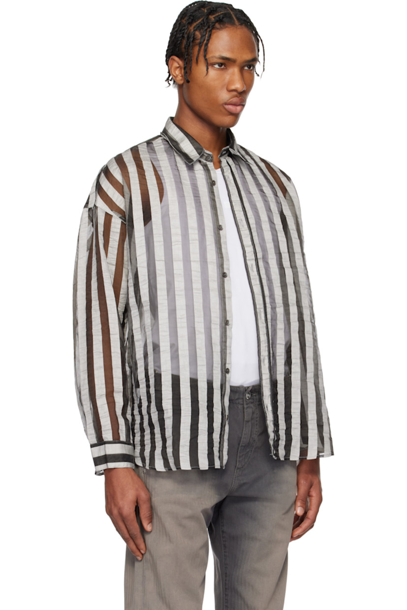 Semi-sheer linen-blend gauze shirt. Stripes throughout. 

· Spread collar
· Button closure
· Shirttail hem
· Dropped shoulders
· Single-button barrel cuffs
· Mother-of-pearl hardware

Supplier color: Grey