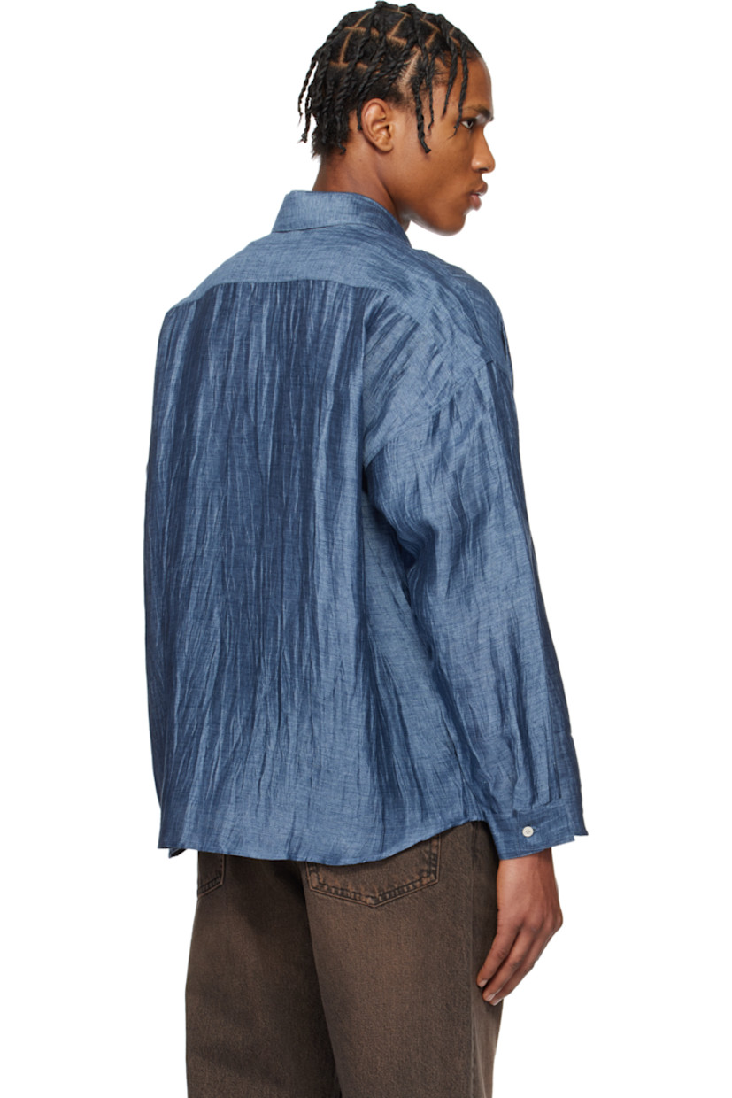 Crinkled linen-blend gauze shirt. 

· Spread collar
· Button closure
· Patch pocket at chest
· Shirttail hem
· Dropped shoulders
· Single-button barrel cuffs
· Mother-of-pearl hardware

Supplier color: Blue