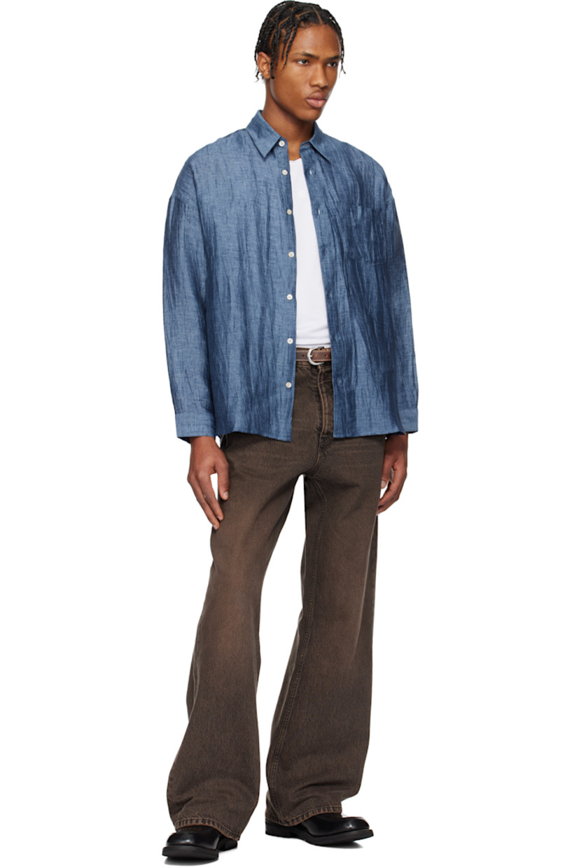 Crinkled linen-blend gauze shirt. 

· Spread collar
· Button closure
· Patch pocket at chest
· Shirttail hem
· Dropped shoulders
· Single-button barrel cuffs
· Mother-of-pearl hardware

Supplier color: Blue