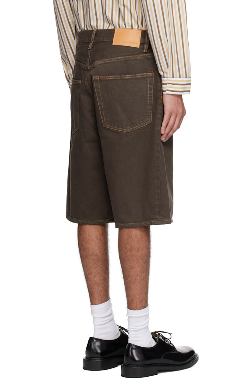 Wide-leg organic cotton twill shorts. Subtle hand-distressing throughout.

· Garment-dyed
· Belt loops
· Five-pocket styling
· Button fly
· Twisted outseams
· Leather logo patch at back waistband
· Logo-engraved silver-tone hardware
· Contrast stitching in tan

Supplier color: Vintage brown
