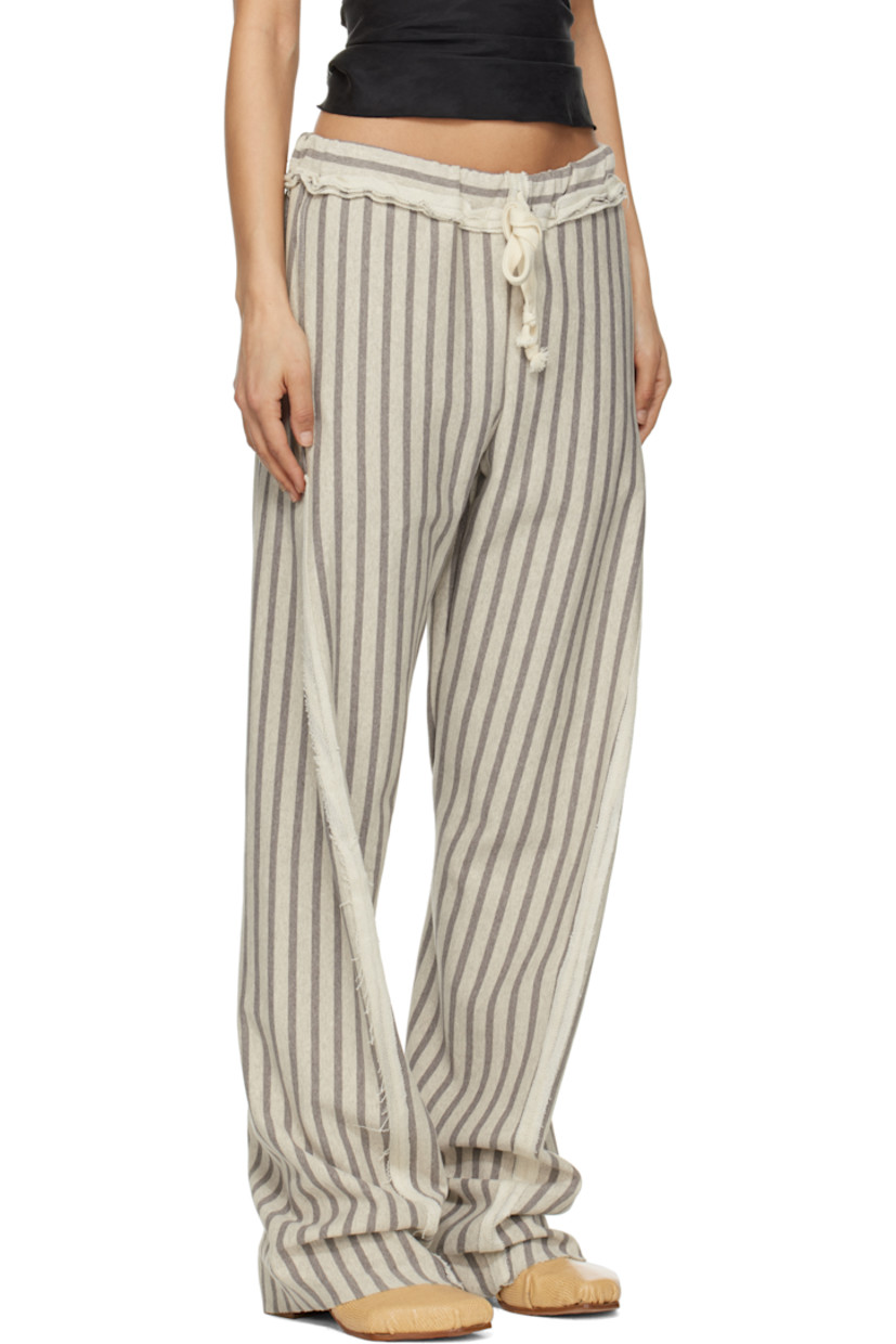 French terry trousers. Stripes and inverted seams with raw edges throughout. 

· Drawstring at elasticized waistband 
· Four-pocket styling
· Twisted inseams and outseams
· Raw edge at cuffs

Supplier color: Grey/Light grey
