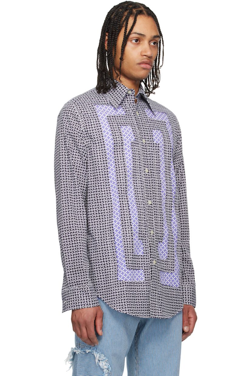 Plain-woven cotton shirt. Raw edges and graphic pattern printed throughout. 

· Patchwork construction
· Spread collar
· Button closure 
· Shirttail hem 
· Buttoned barrel cuffs
· Contrast stitching in white

Supplier color: Navy/White blue pink