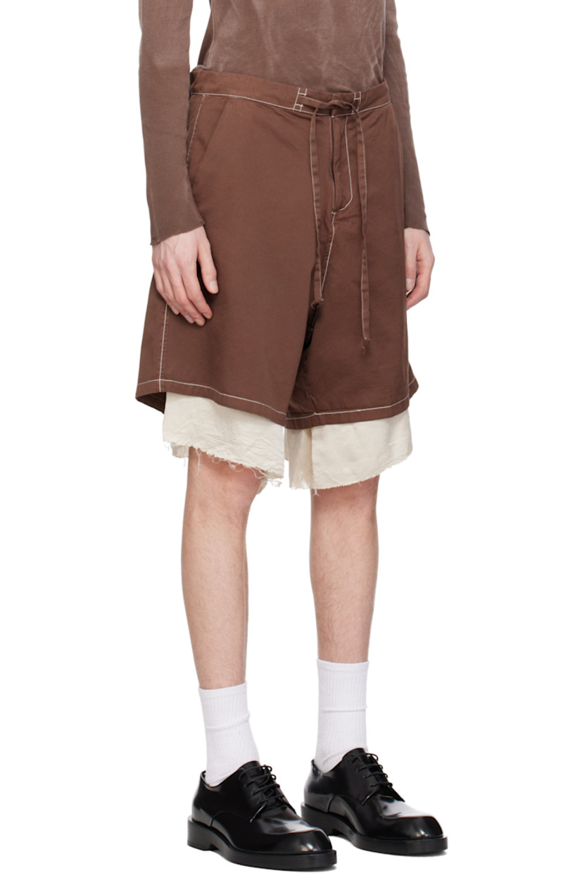 Piece-dyed cotton drill shorts. 

· Drawstring at waistband
· Four-pocket styling
· Zip fly
· Exposed crinkled satin lining with raw edge at cuffs
· Contrast stitching in off-white

Supplier color: Washed brown/Cream
