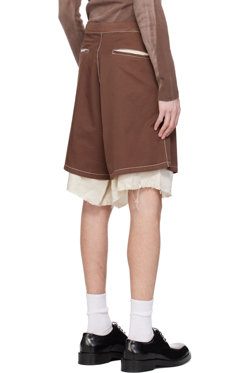 Piece-dyed cotton drill shorts. 

· Drawstring at waistband
· Four-pocket styling
· Zip fly
· Exposed crinkled satin lining with raw edge at cuffs
· Contrast stitching in off-white

Supplier color: Washed brown/Cream