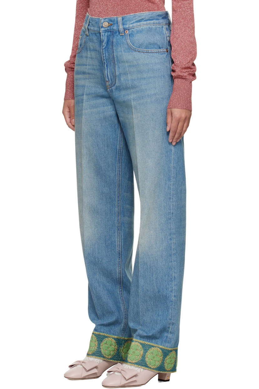 Non-stretch denim jeans. Fading and whiskering throughout.

· Belt loops
· Five-pocket styling
· Zip fly
· Creased legs
· Jacquard graphic pattern at cuffs
· Leather logo patch at back waistband
· Logo-engraved antiqued brass- and copper-tone hardware
· Contrast stitching in tan 

Supplier color: Denim