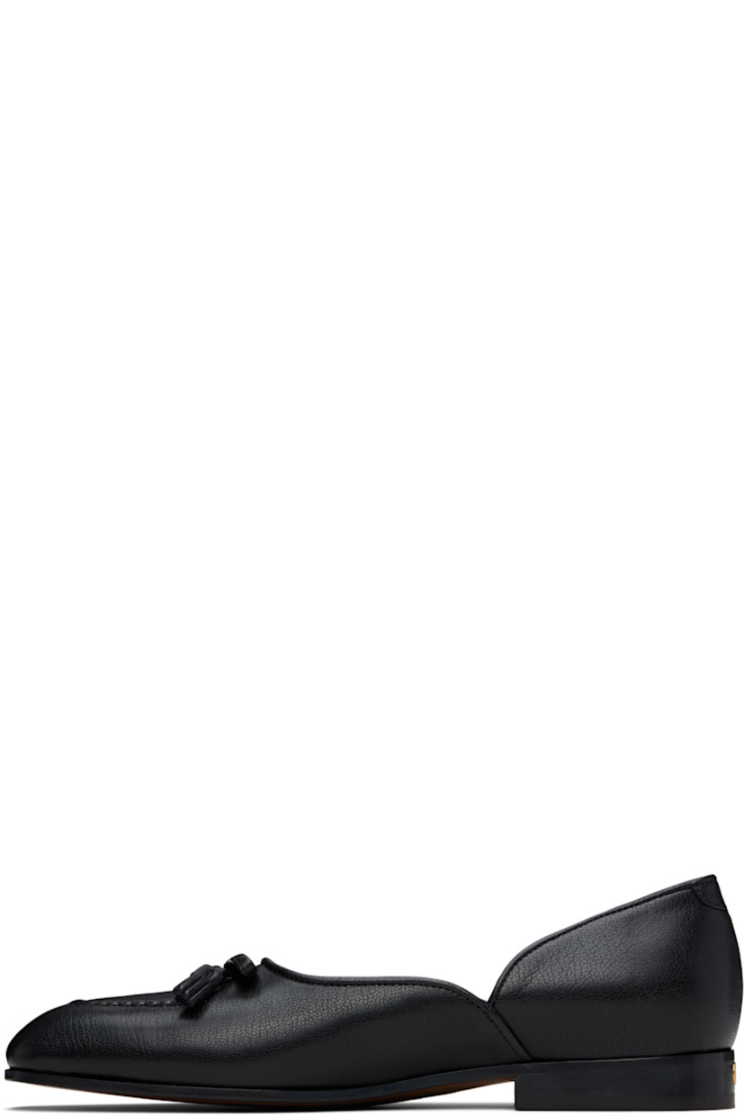 Grained calfskin loafers in black.

· Square moc toe
· Bow accent at vamp
· Logo hardware at heel 
· Stacked leather heel with rubber injection
· Leather sole 
· Gold-tone hardware

Supplier color: Nero