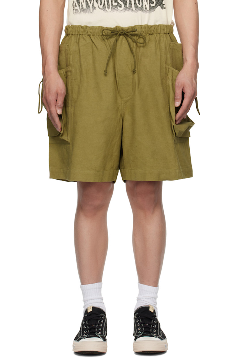 Plain-woven organic cotton shorts.

· Iron- and kaduka-dyed
· Drawstring at elasticized waistband
· Three-pocket styling
· Mock fly
· Drawstring at cargo pockets

Supplier color: Olive slub