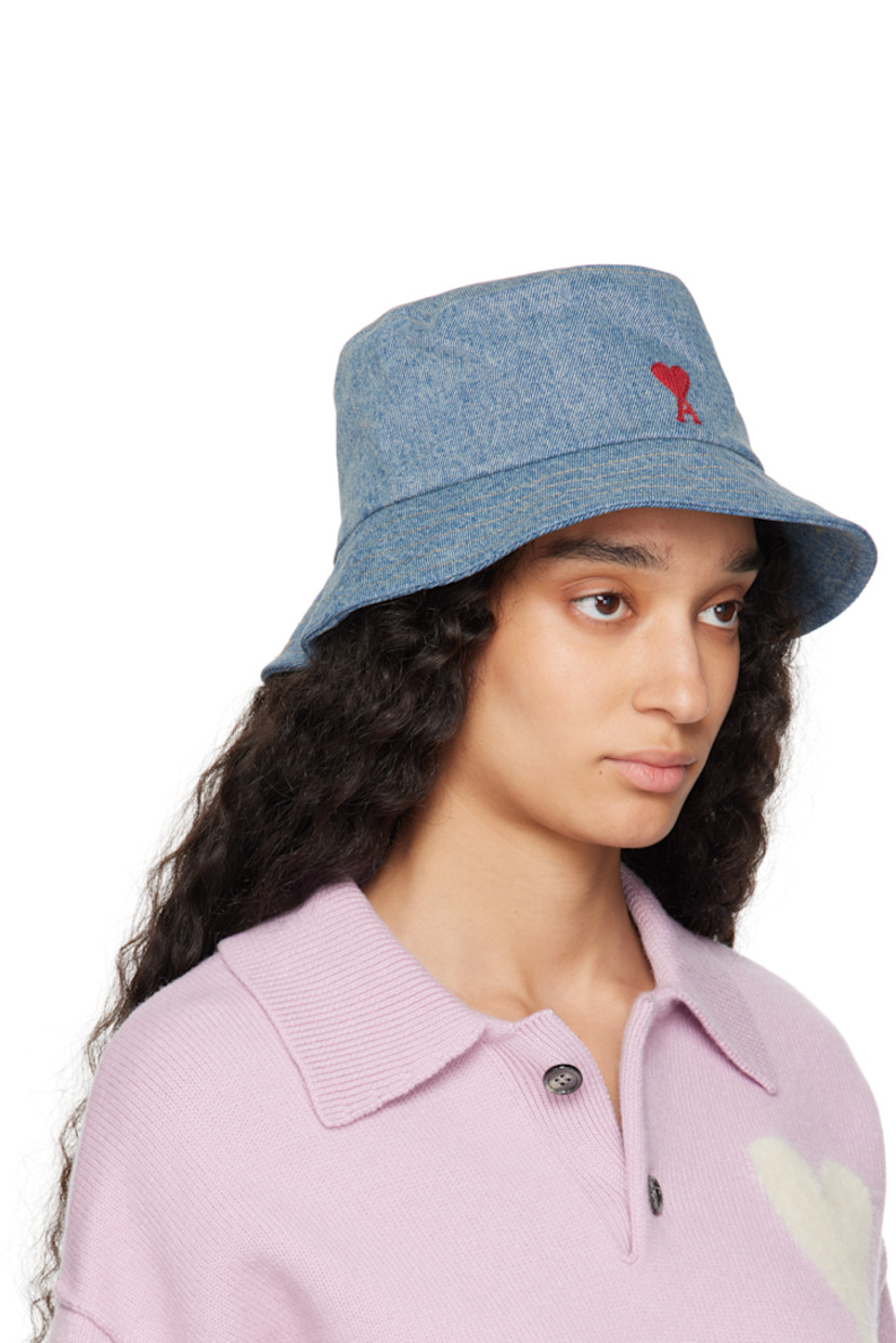 Denim bucket hat in blue.

· Fading throughout
· Logo embroidered at face
· Quilted brim
· Cotton poplin lining

Supplier color: Used blue