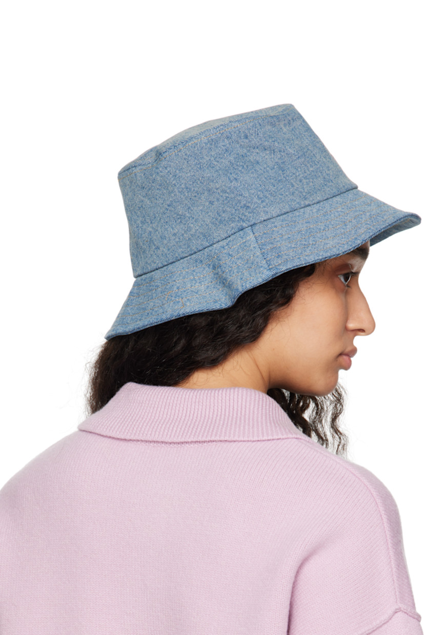 Denim bucket hat in blue.

· Fading throughout
· Logo embroidered at face
· Quilted brim
· Cotton poplin lining

Supplier color: Used blue