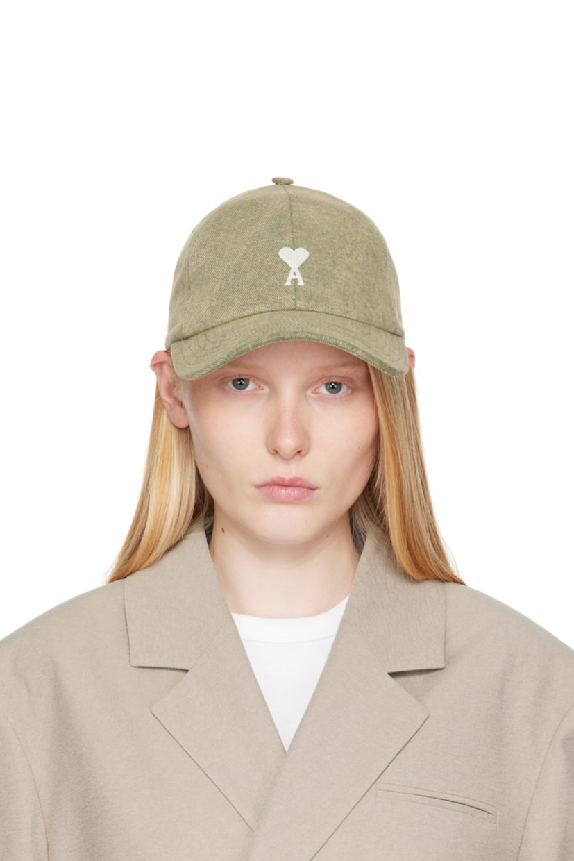 Cotton twill cap in khaki.

· Fading throughout
· Embroidered eyelets at crown
· Logo embroidered at face
· Curved brim
· Cinch fastening
· Plain-woven viscose lining

Supplier color: Laurel