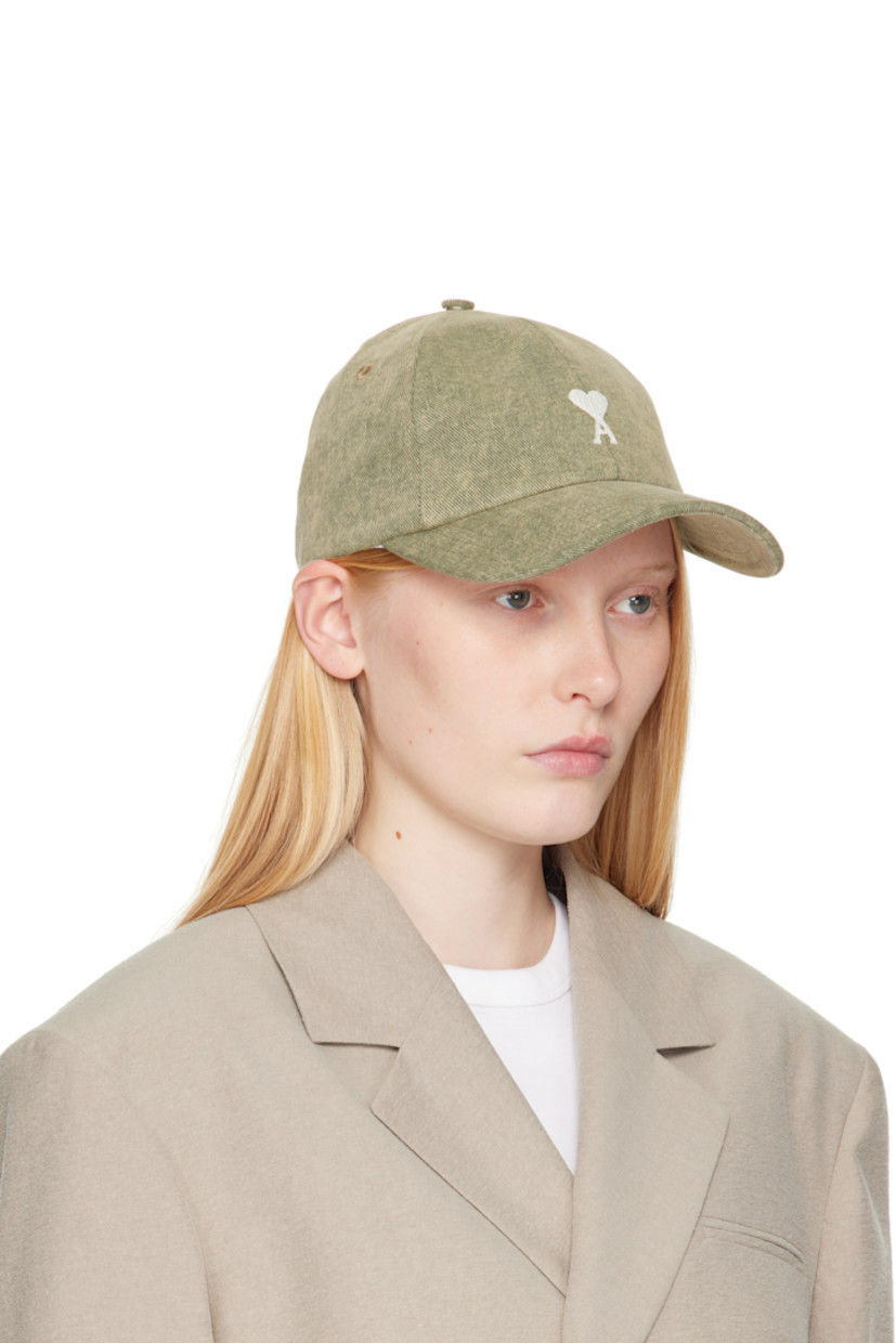 Cotton twill cap in khaki.

· Fading throughout
· Embroidered eyelets at crown
· Logo embroidered at face
· Curved brim
· Cinch fastening
· Plain-woven viscose lining

Supplier color: Laurel