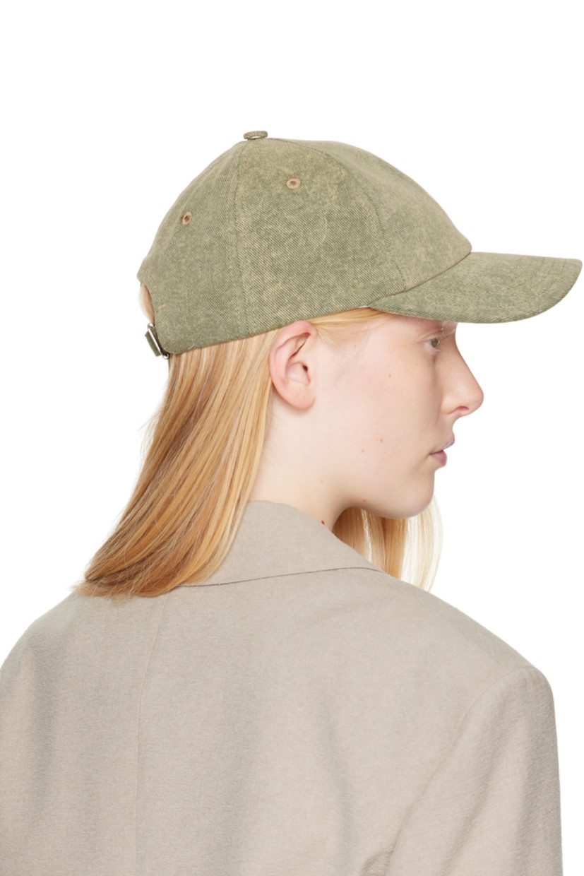 Cotton twill cap in khaki.

· Fading throughout
· Embroidered eyelets at crown
· Logo embroidered at face
· Curved brim
· Cinch fastening
· Plain-woven viscose lining

Supplier color: Laurel