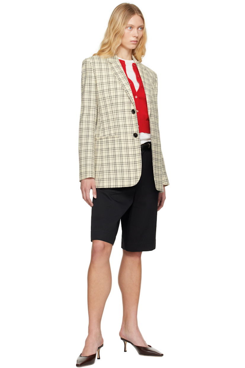 Virgin wool canvas blazer. Check pattern and darts throughout.

· Notched lapel
· Button closure
· Welt pockets
· Padded shoulders
· Four-button surgeon's cuffs
· Central vent at back hem
· Welt pockets at interior
· Partial twill and satin lining

Supplier color: White cream/Black