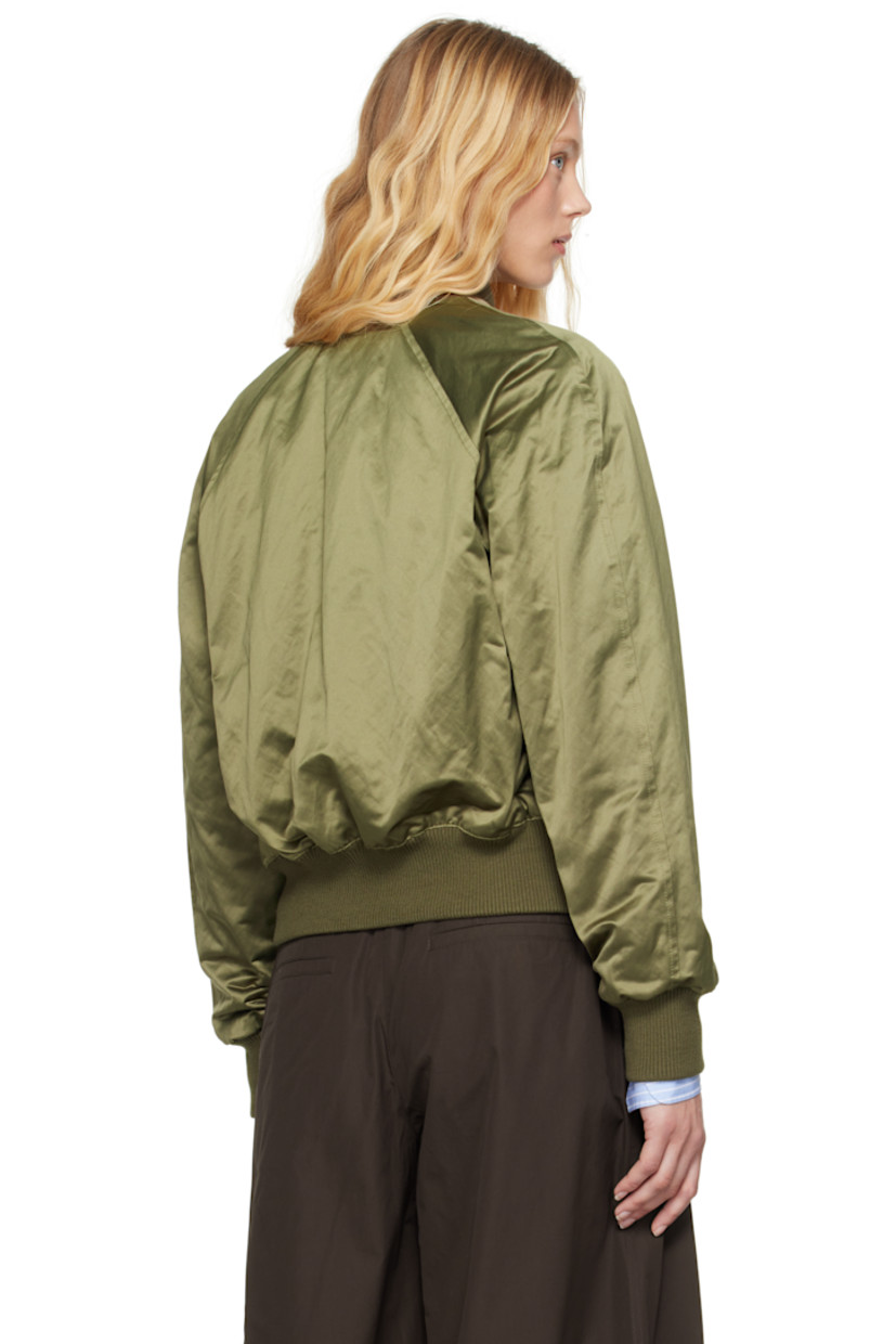 Padded cotton- and polyester-blend satin bomber jacket.

· Rib-knit stand collar, hem, and cuffs
· Two-way zip closure
· Logo embossed at chest
· Flap pockets
· Raglan sleeves
· Welt pocket at interior
· Full twill lining

Supplier color: Loden