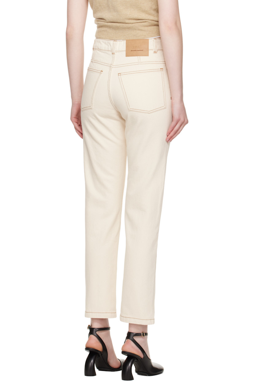 Non-stretch denim jeans.

· Belt loops
· Five-pocket styling
· Zip fly
· Logo patch at back waistband
· Contrast stitching in tan

Supplier color: White cream