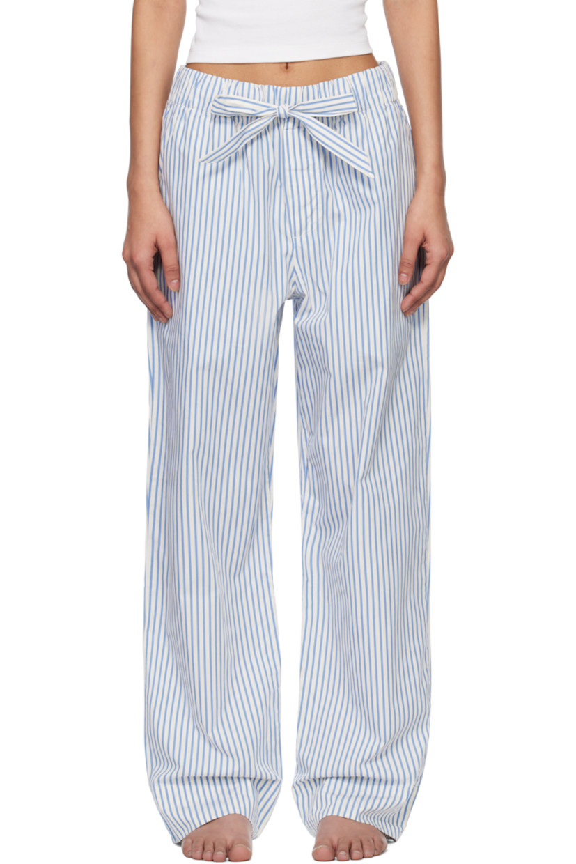 Stonewashed and lightweight organic cotton poplin pyjama pants. Stripes throughout. 

· Straight-leg and oversized
· Oeko-Tex® Standard 100-certified
· Drawstring at elasticized waistband
· Three-pocket styling
· Button fly
· Logo patch at back pocket

Supplier color: Placid blue