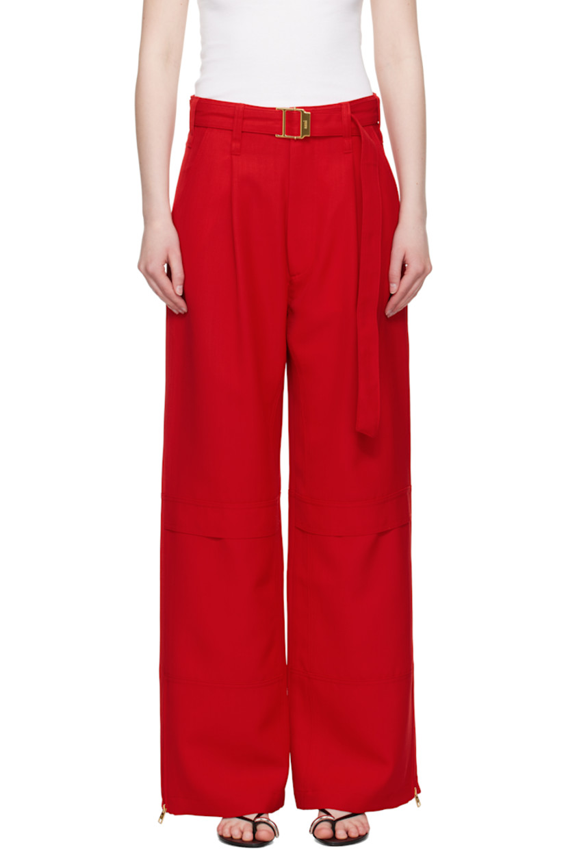 Wide-leg virgin wool canvas cargo pants.

· Belt loops and detachable cinch belt at waistband
· Four-pocket styling
· Zip fly
· Mock cargo pocket at front legs
· Zip vent at cuffs
· Horn hardware

Supplier color: Poppy