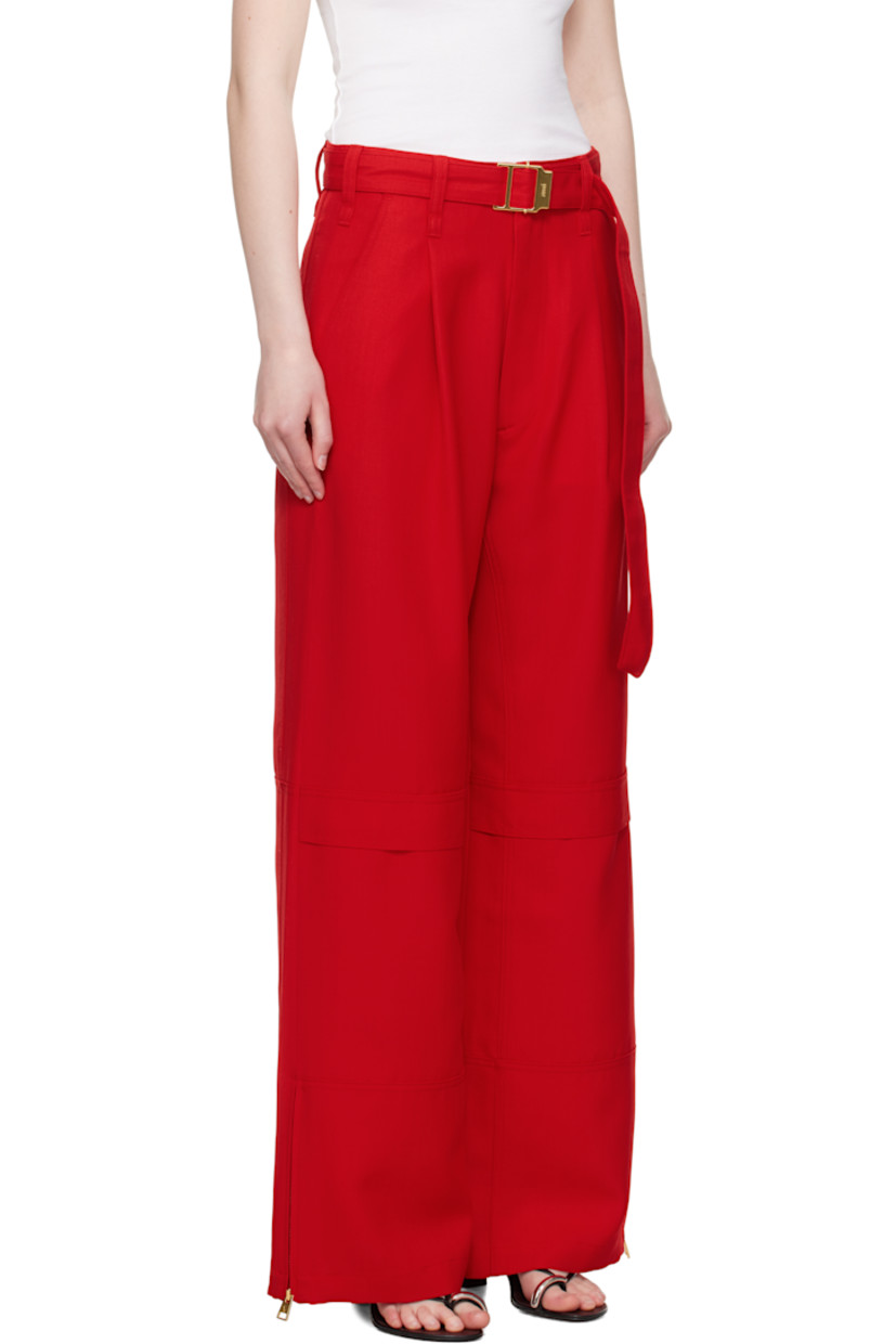 Wide-leg virgin wool canvas cargo pants.

· Belt loops and detachable cinch belt at waistband
· Four-pocket styling
· Zip fly
· Mock cargo pocket at front legs
· Zip vent at cuffs
· Horn hardware

Supplier color: Poppy