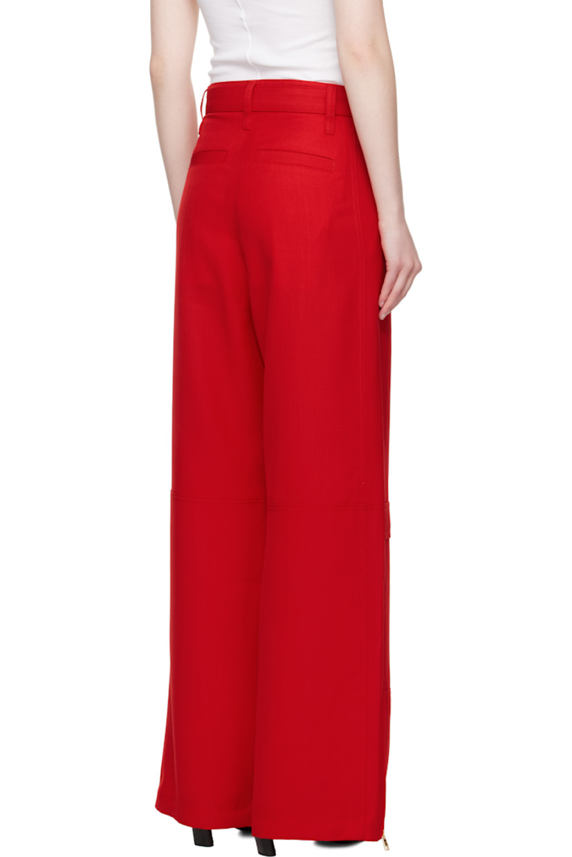 Wide-leg virgin wool canvas cargo pants.

· Belt loops and detachable cinch belt at waistband
· Four-pocket styling
· Zip fly
· Mock cargo pocket at front legs
· Zip vent at cuffs
· Horn hardware

Supplier color: Poppy