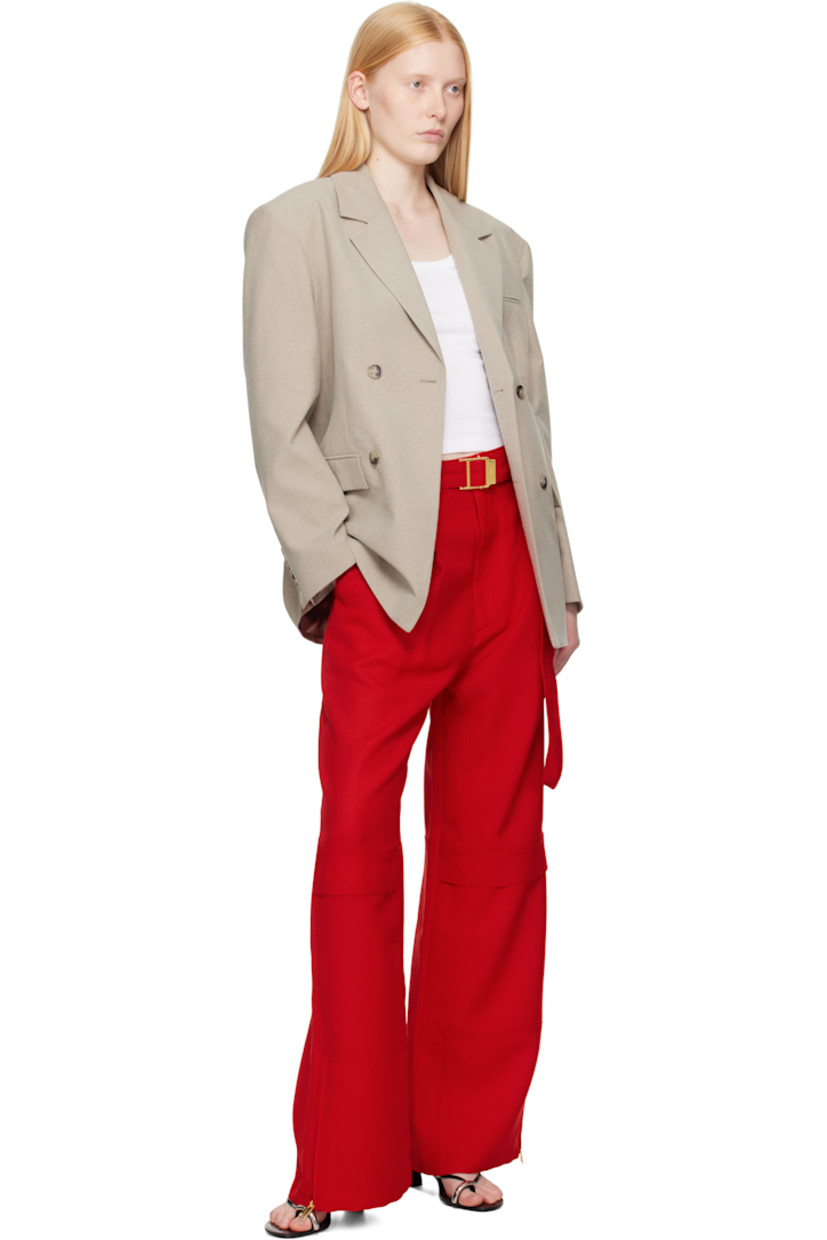 Wide-leg virgin wool canvas cargo pants.

· Belt loops and detachable cinch belt at waistband
· Four-pocket styling
· Zip fly
· Mock cargo pocket at front legs
· Zip vent at cuffs
· Horn hardware

Supplier color: Poppy