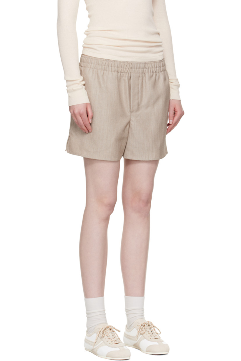 Virgin wool grain de poudre shorts. 

· Elasticized waistband
· Three-pocket styling
· Mock fly
· Vented cuffs
· Logo patch at back pocket

Supplier color: Ginger